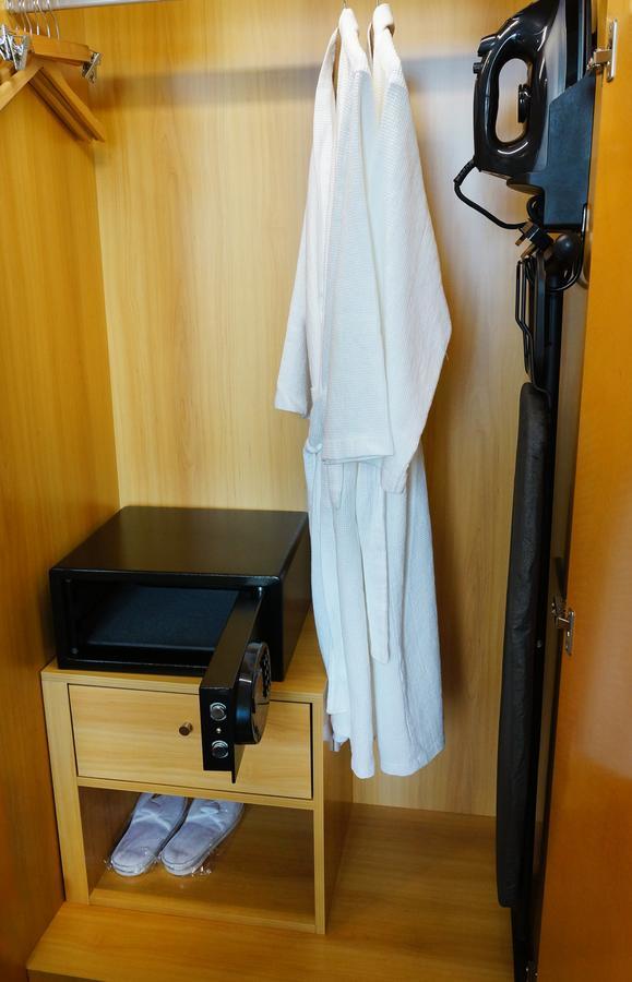 The Waterfront Hotel Kuching Dış mekan fotoğraf A bathrobe hanging in a closet